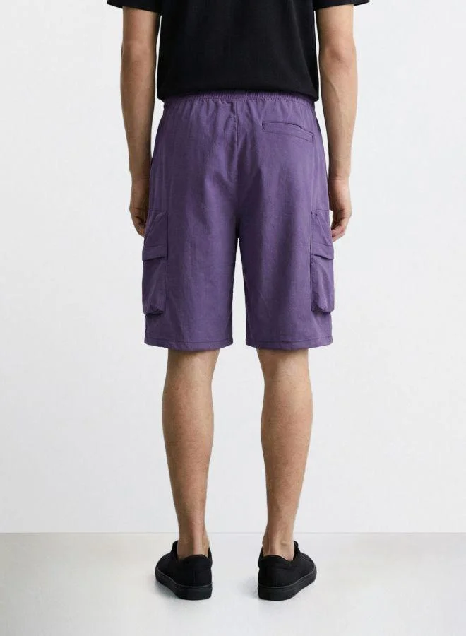 The Indian Garage Co Men Relaxed Fit Solid Cargo Pocket Mid-Rise Cargo Shorts